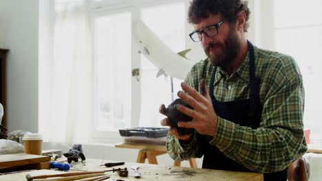 craftsman working on clay sculpture 4k