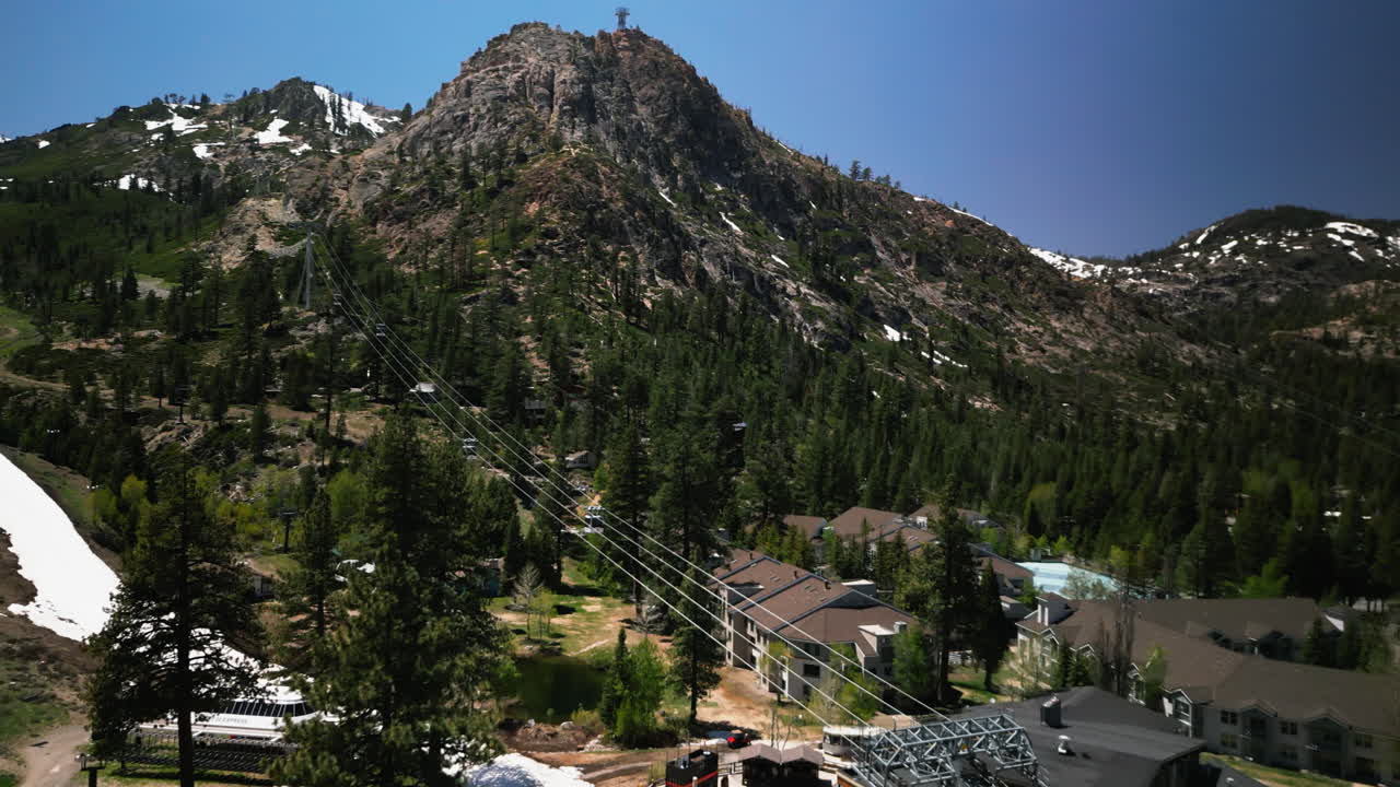 Aerial drone footage flying over dense pine forest at Lake Tahoe, California. Bird's eye view of treetops in Sierra Nevada mountains. Perfect for nature documentaries and California travel content