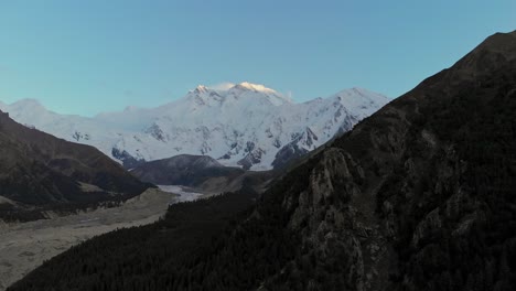 Aerial-reveals-Nanga-Parbat-Mountain-Pakistan,-snowy-peaks,-blue-morning-skyline