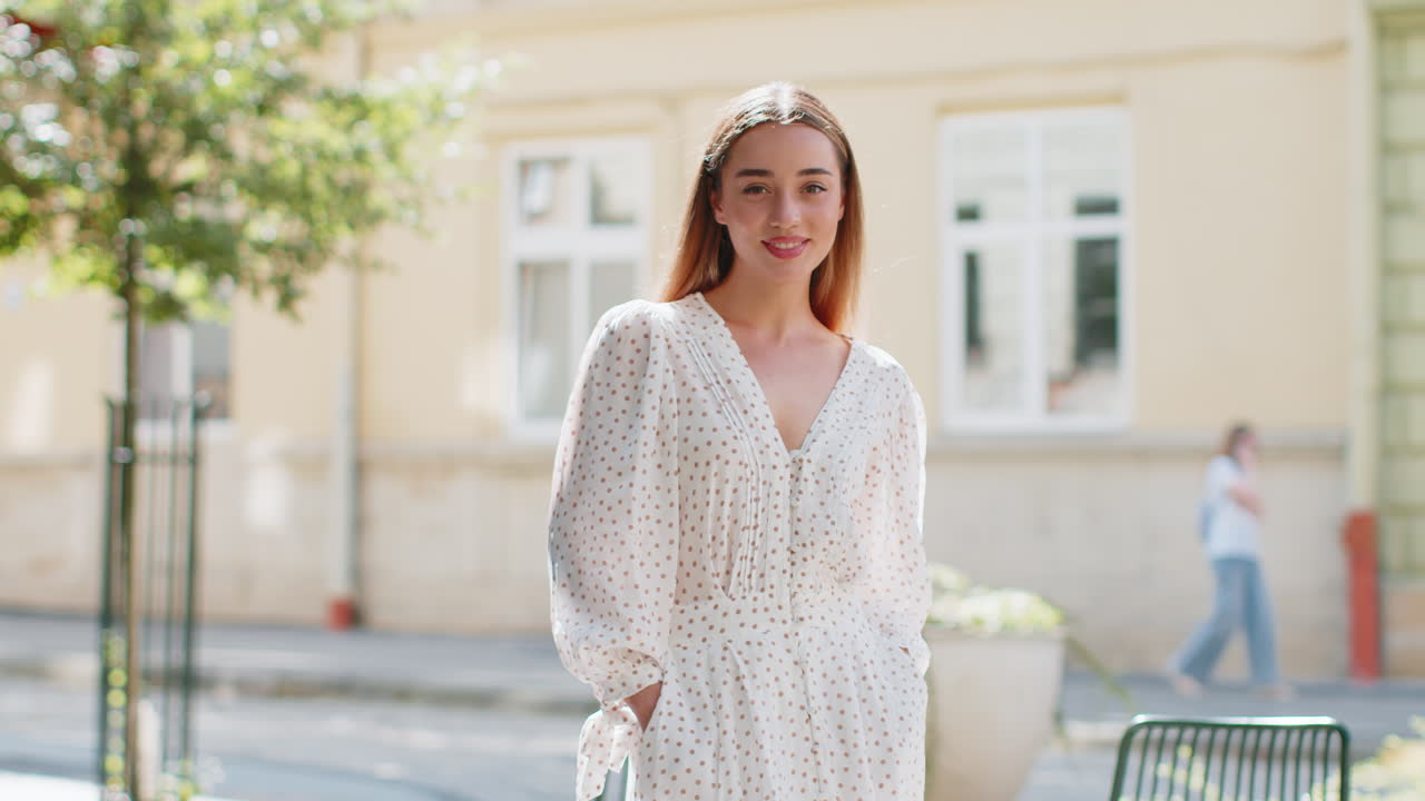 Portrait of happy woman stands with her back turns around smiling glad expression looking at camera
