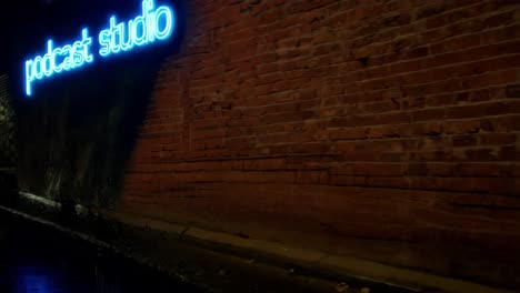 podcast studio neon sign at night