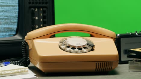 retro vintage phone, a yellow rotary telephone is displayed on a wooden desk, adding a nostalgic touch