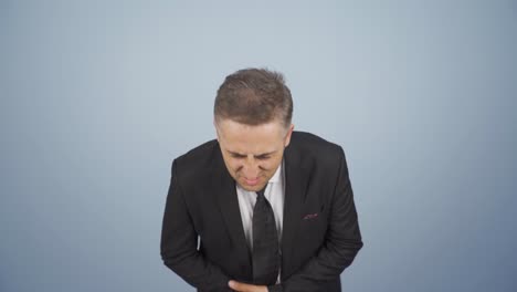 hombre de negocios con dolor de estómago.
