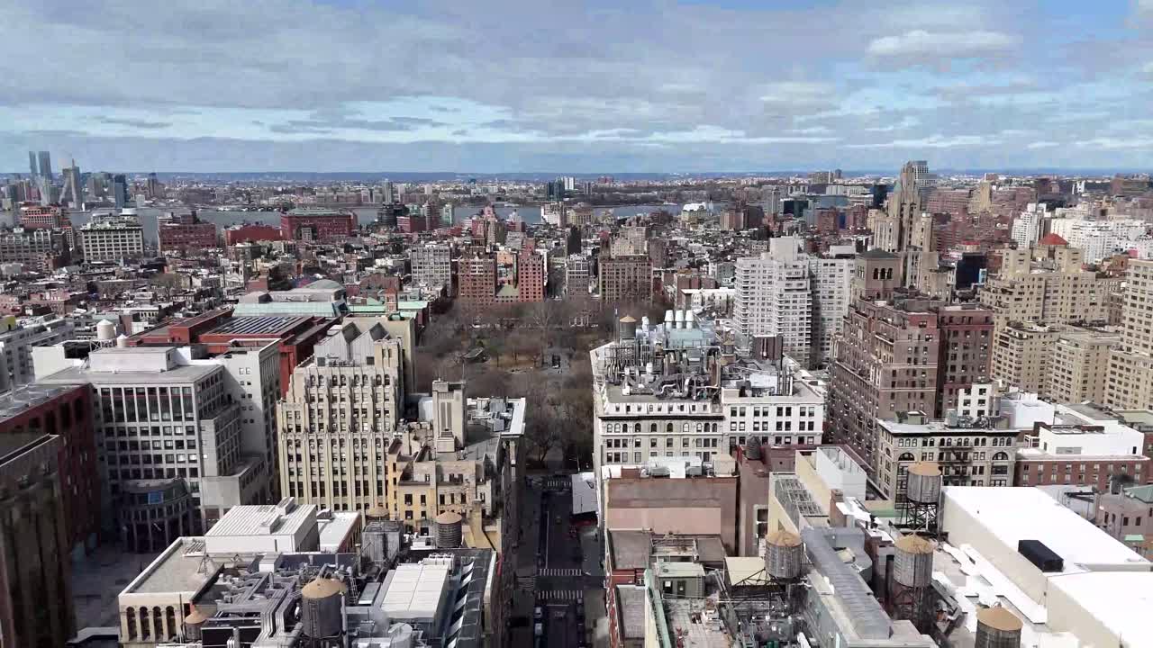 Horizontal drone ascending shot over Broadway in New York, showcasing the city's bustling streets, iconic architecture, and vibrant skyline as the camera smoothly rises.