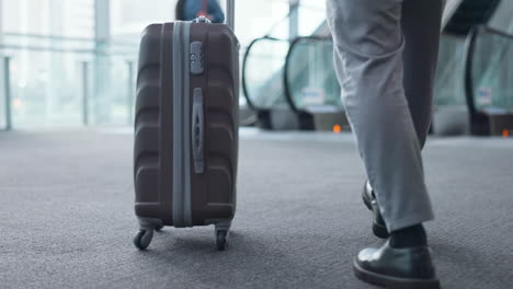 businessman, feet and walking in airport