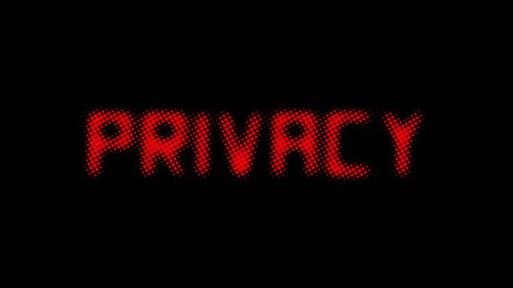 Un messaggio di testo rosso a mezzatinta che appare da uno sfondo bianco uniforme e si dissolve lentamente: Privacy.