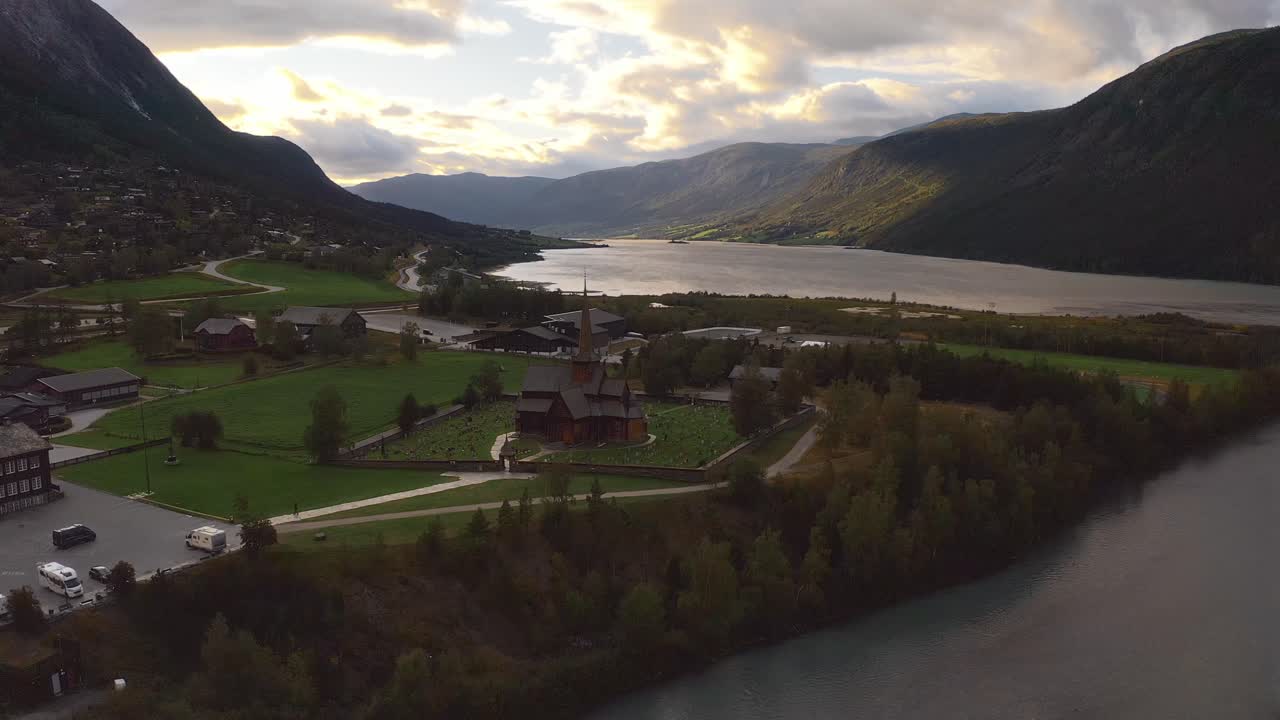Scenic norway landscape with a church, river, and mountains, aerial view