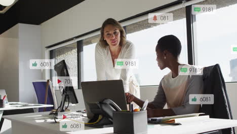 Animation-of-multiple-notification-bars-over-diverse-female-coworkers-discussing-reports-on-laptop