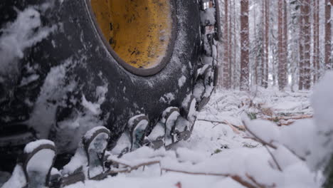 Heavy-forest-machinery-in-winter,-close-up-detail-shot