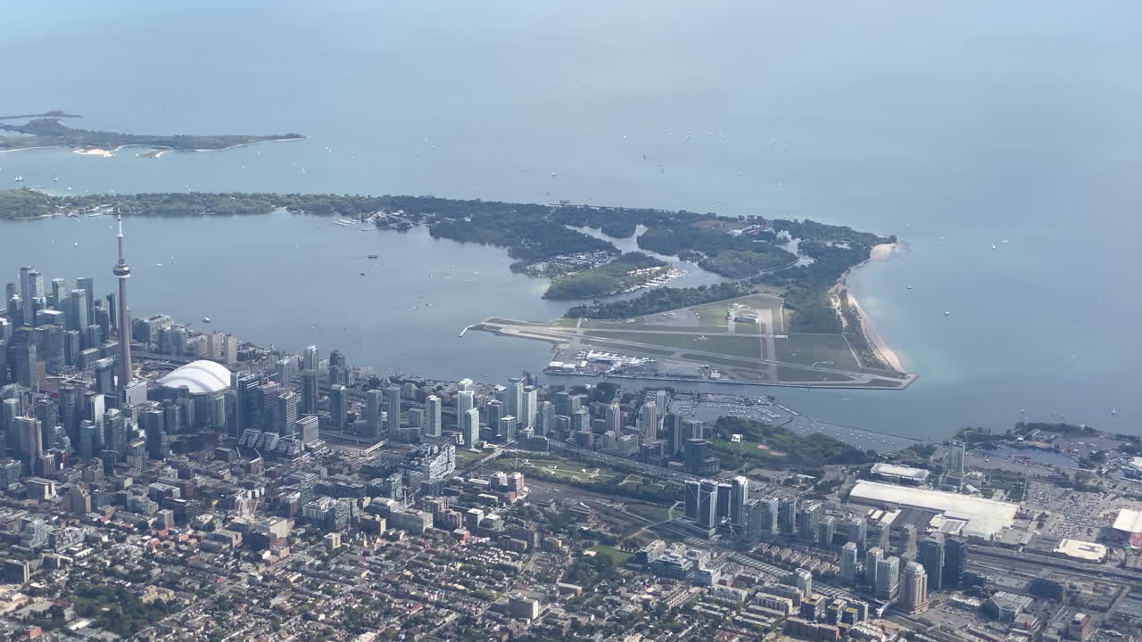 An aerial view slowly revealing downtown Toronto from west to east