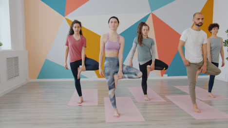 group yoga class in a modern studio