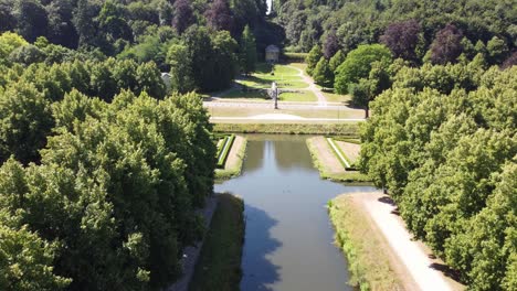 Aerial-video-of-nature's-park-in-Kleve,-Germany-covering-blue-water-channels,-fountains-and-statues