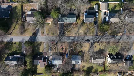 aerial birds eye shot of idyllic suburb neighborhood in american town