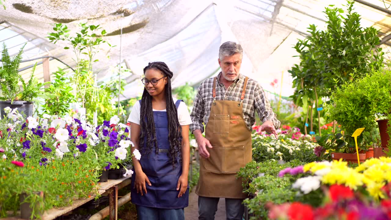 People gardening in a greenhouse