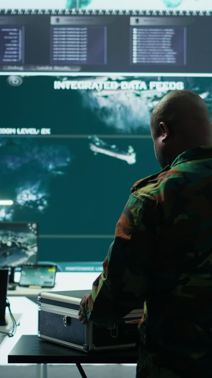 Vertical Video Military specialist in command post uses advanced technology and high tech gear