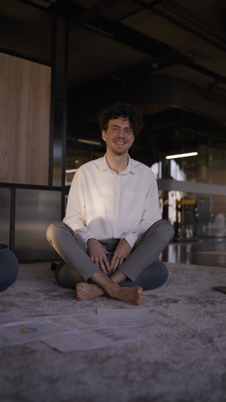 Man Sitting Comfortably in Office