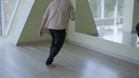 man breakdancing in modern studio