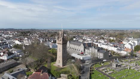 Flight-over-Fire-Station,Arsenal-and-cemetery-St-Peter-Port,Guernsey-on-bright-day-close-to-tower