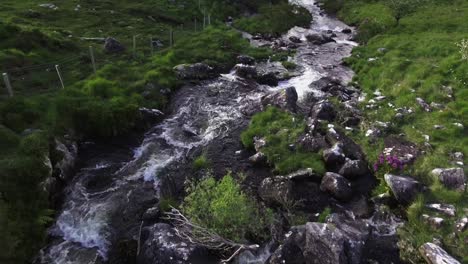 Aerial-drone-shot-of-a-small-river-in-Ireland