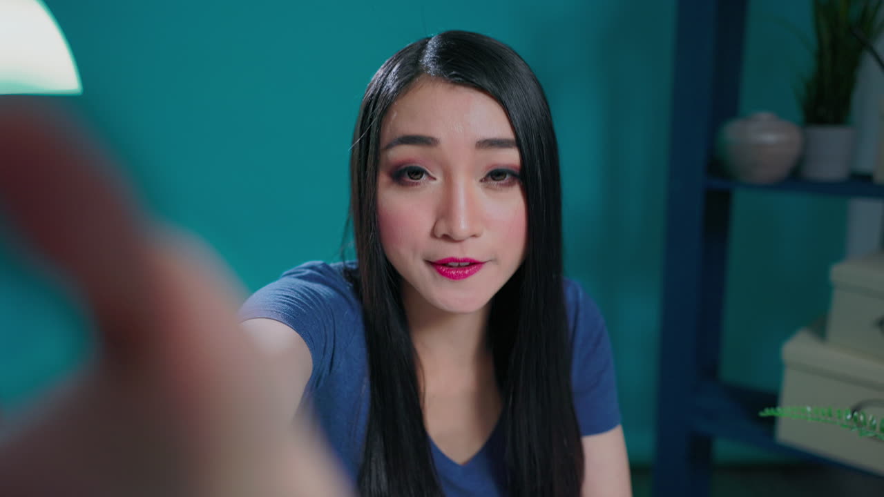 POV of female vlogger recording videoblog on camera