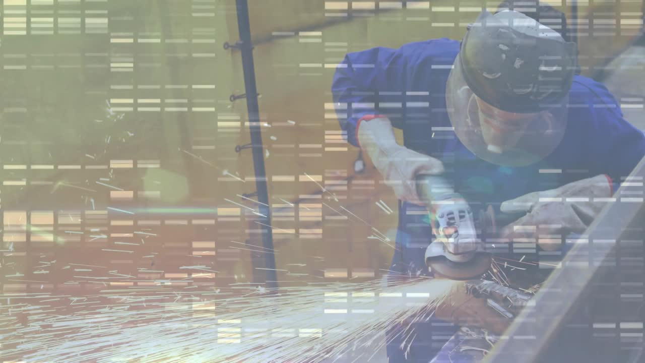 Male metalworker using angle grinder in industrial workshop, sending bright sparks from steel beam