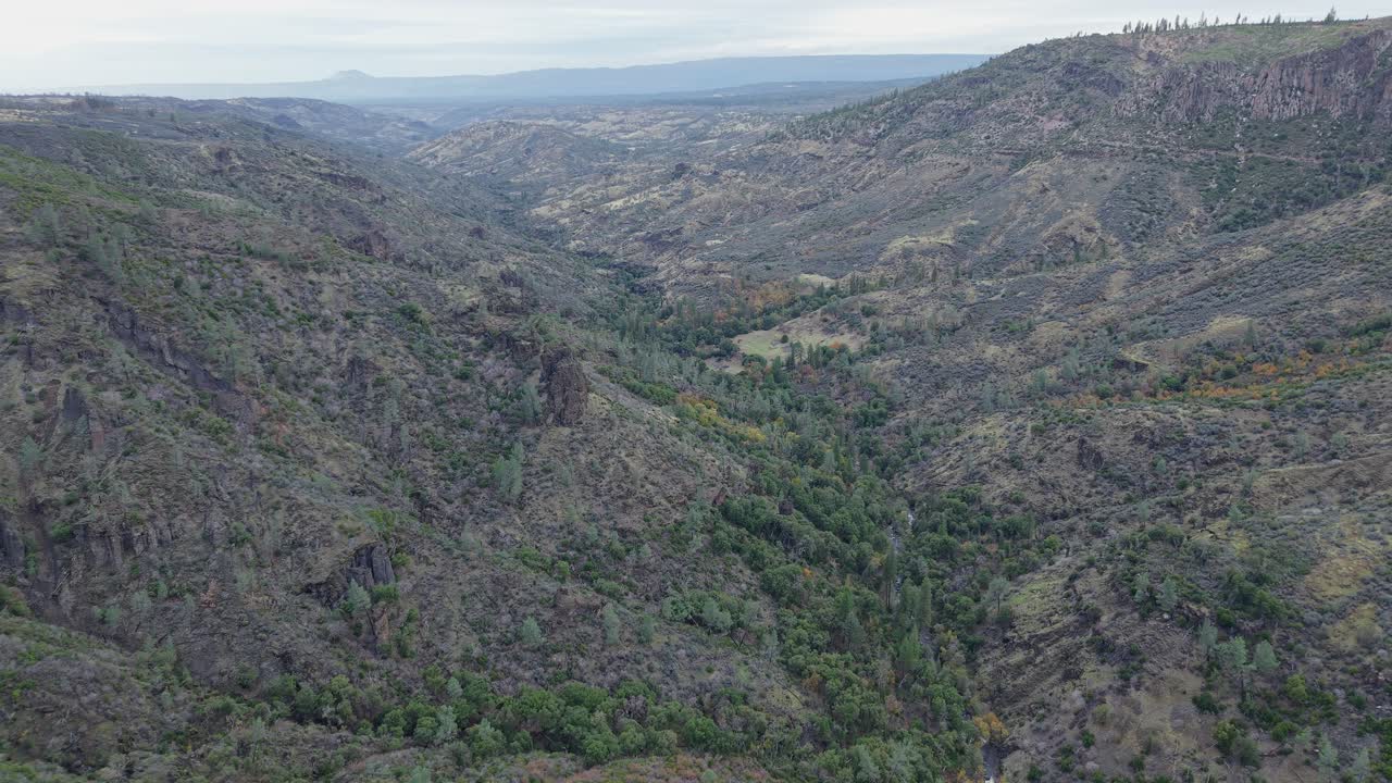The camera pans across Paynes Creek Point’s varied scenery, then slowly closes in on the terrain’s features, revealing layers of texture, muted colors, and natural formations shaped by time