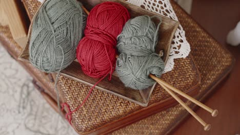 knitting yarn and needles on tray