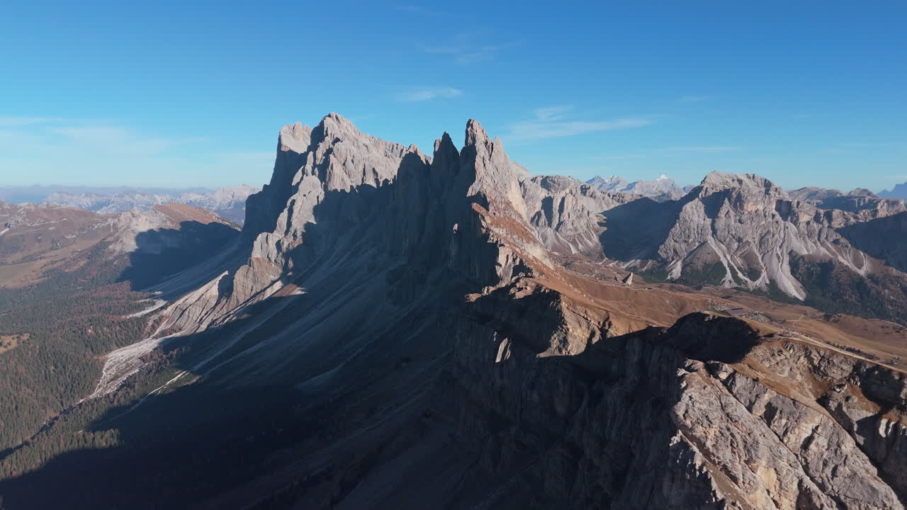 Drone approach toward imposing Seceda Ridgeline in alpine Italian Alps