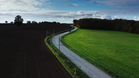 Cinematic-aerial-shot-of-France-landscape,-trees,-roads-and-villages