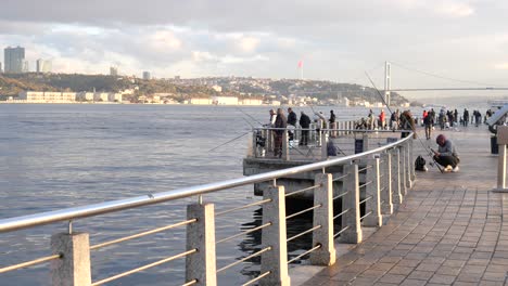 people fishing on the bosphorus in istanbul