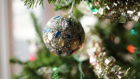 christmas ornament: bauble with jewels swinging