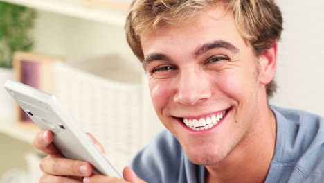 Young-man-using-calculator