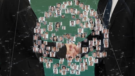 animation of portraits of diverse people over business handshake