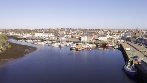 Drone-shot-of-Stornoway-Harbour-on-a-sunny-day-on-the-Isle-of-Lewis,-Outer-Hebrides-of-Scotland,-United-Kingdom