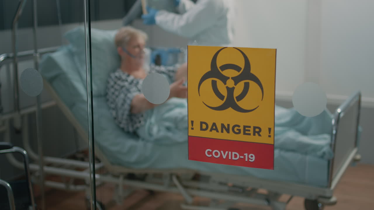 Close up of danger sign on glass of hospital ward