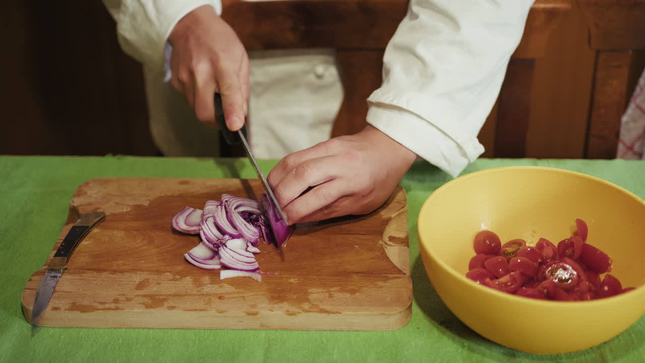 Chef Chopping Red Onions and Tomatoes