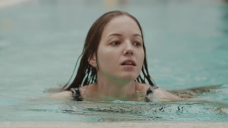 portrait of woman swimming in pool