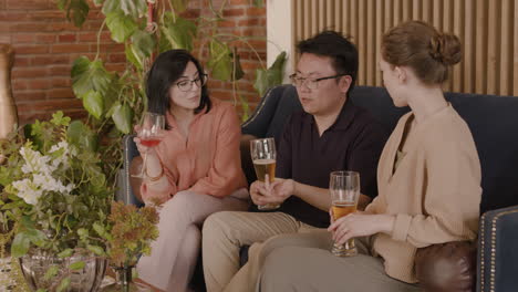 an young man talking with two young beautiful girls