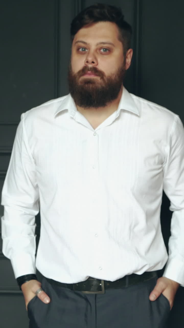 Brutal man in studio. Young casual bearded man posing in studio