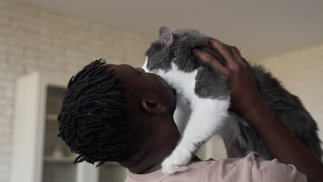 pet owner with his cat at the kitchen