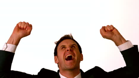 Businessman-cheering-on-white-background