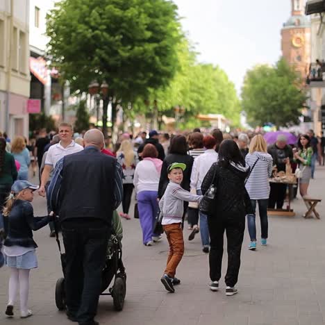 mass of people walking in the city