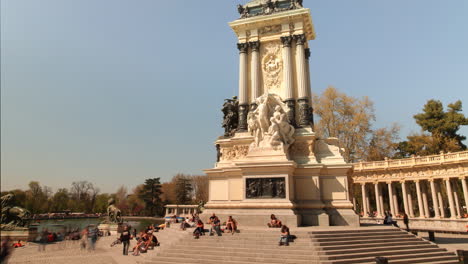 monument in the park with people relaxing