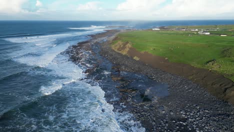 aerial orbiting shot of the rugged cliffscape at dollin, ireland during summer