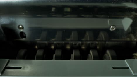 euro banknotes being processed by a counting machine