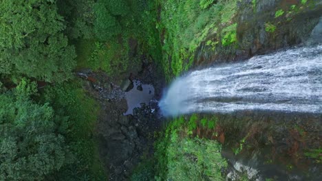 top view of waterfall falling into the jungle in the salto del rodeo region of bonao