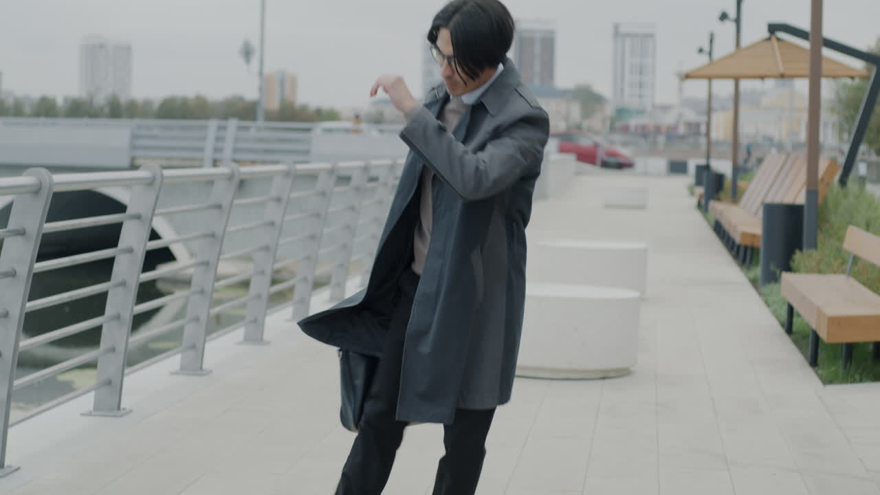 Man Walking in Urban Park