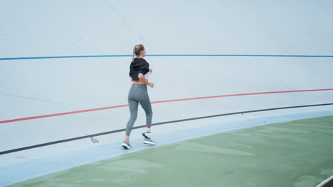 woman running on sports track