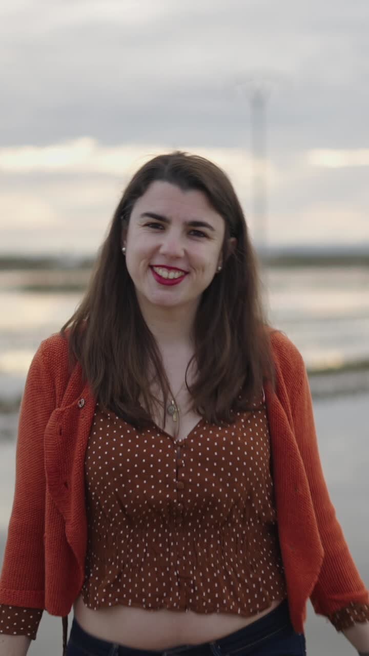 A woman smiling outdoors