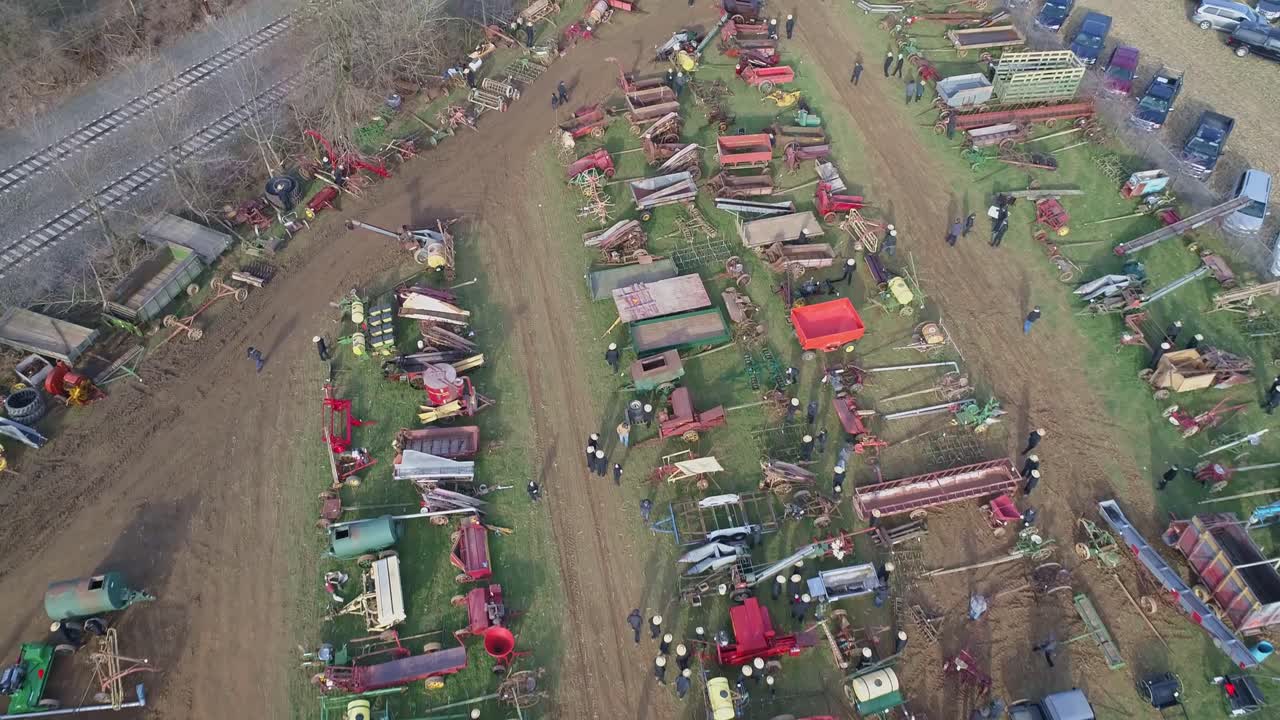 Aerial of an Early Morning View of Opening Day at an Amish Mud Sale Auctioning Farm Equipment to Quilts